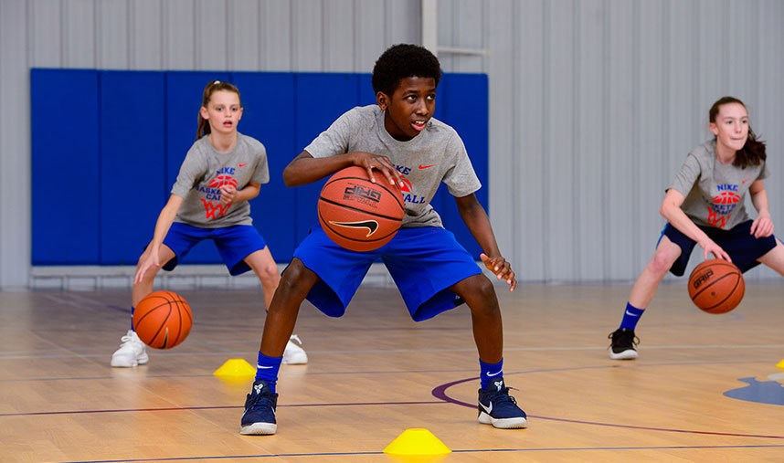 3 Kids dribbling a basketball for training - Youth Basketball training